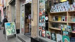  The storefront where a bomb exploded 20 years ago, the shop window filled with portraits of people