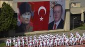 Mustafa Kemal Ataturk (left) and Recep Tayyip Erdogan (right) displayed on banners during a naval display in Istanbul