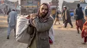 An Afghan refugee carrying a load in Pakistan