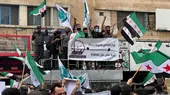 Protesters waving flags and banners