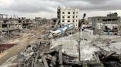 A crumbling building surrounded by rubble.